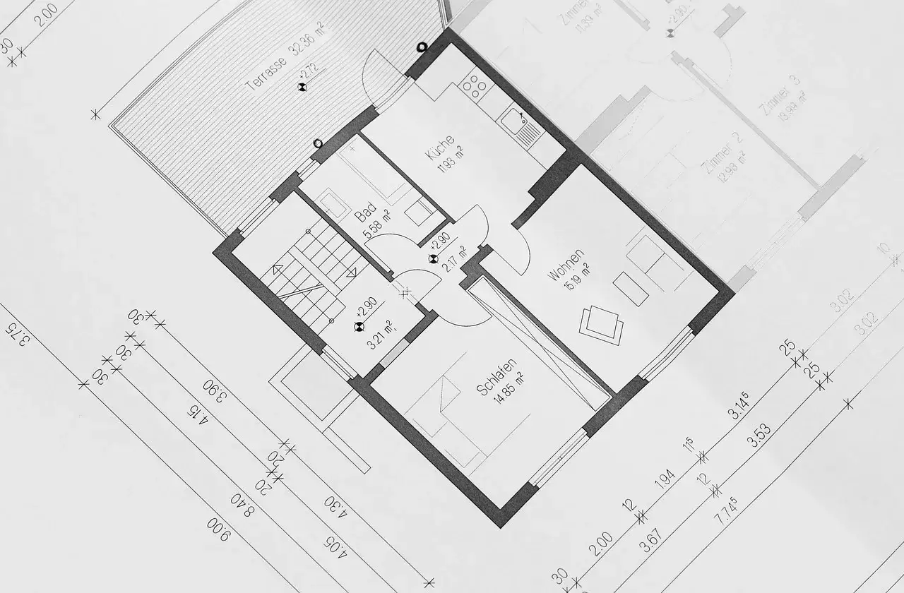 Plan architektoniczny przedstawiający powierzchnię wewnętrzną budynku z podziałem na pomieszczenia: kuchnię, łazienkę, salon, sypialnię i taras.